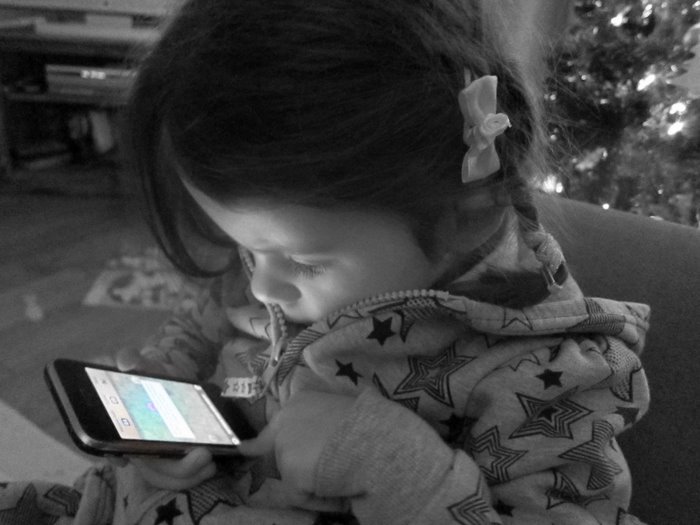 My daughter playing with my Iphone